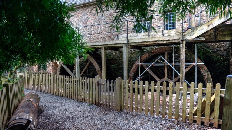 A view of the waterwheels from the bottom of the observation platform steps, Dunster Working Watermill, Somerset